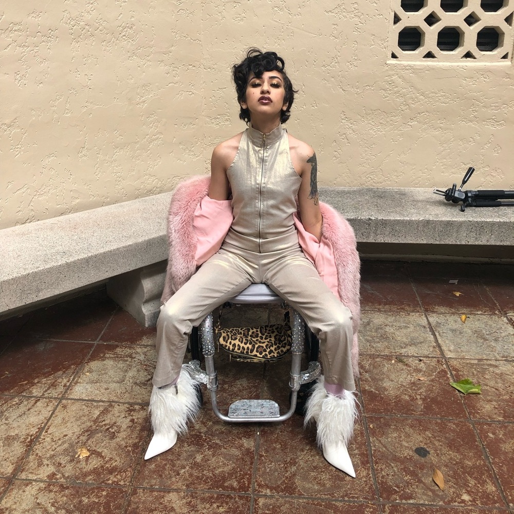 Gold shiny androgynous 80s glam rock high neck fitted zip front jumpsuit